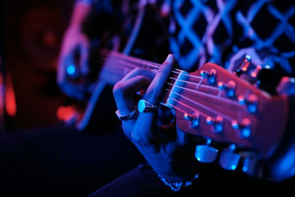 Unrecognizable Man Playing Guitar