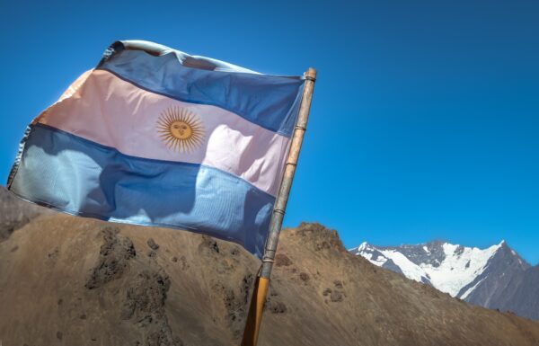 Argentina flag with Nevado Juncal Mountain in Cordillera de Los Andes - Mendoza Province, Argentina