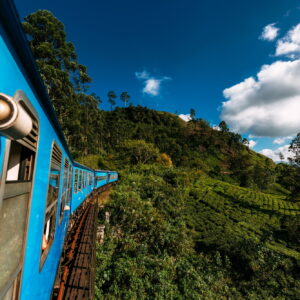 Train from Nuwara Eliya to Kandy among tea plantations in the highlands of Sri Lanka